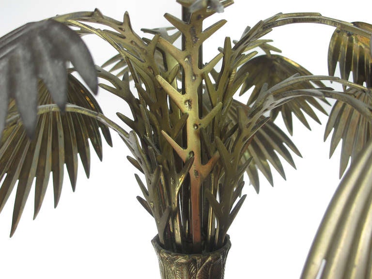 Cast bronze palm tree lamp with octagonal solid brass base and brass leaves. Retains manufacturer's label on one socket. Immaculate condition.