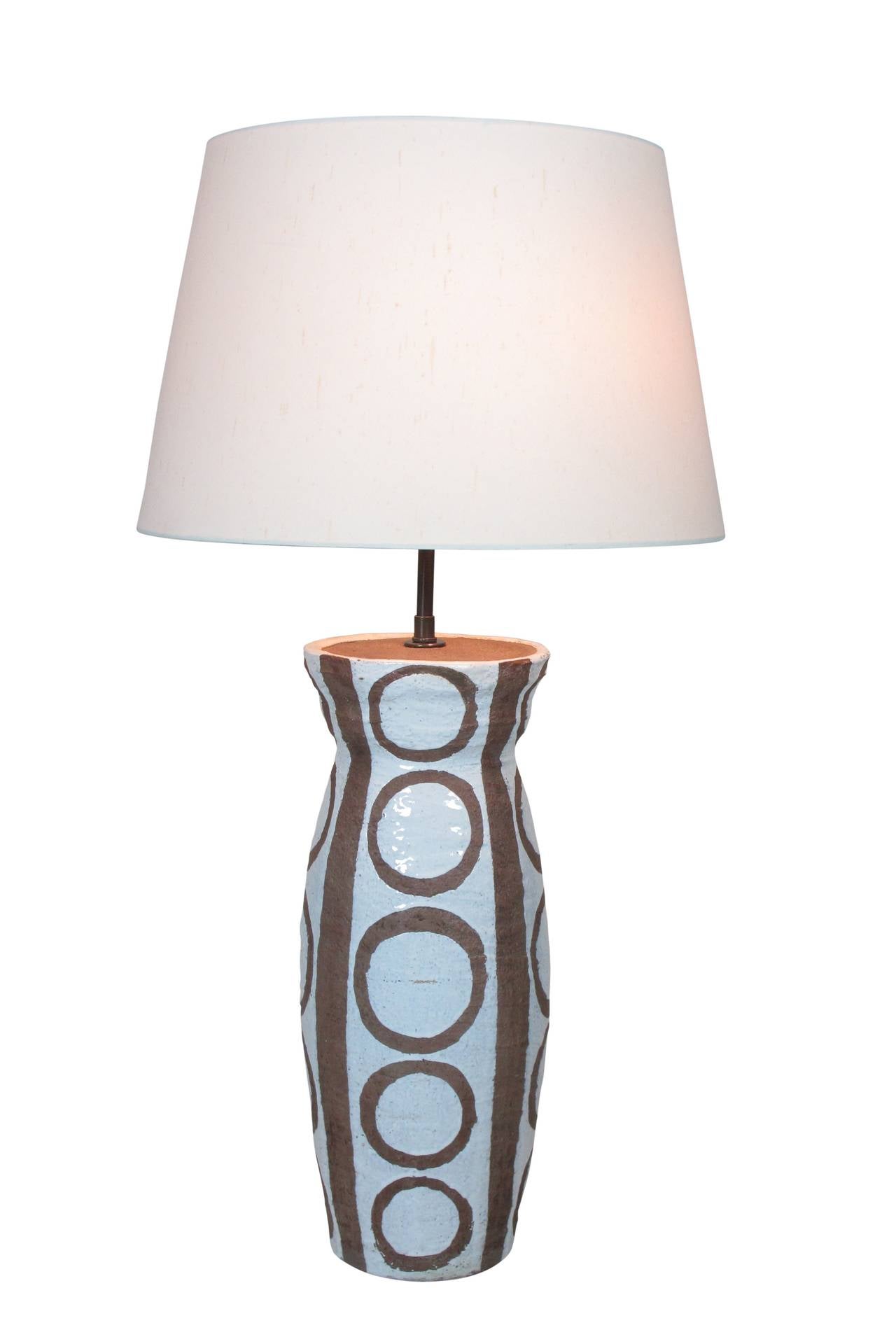 Chocolate glazed circle pattern over white glaze hand-thrown ceramic table lamp. Rewired for immediate use. Ceramic only measures 18.5 inches. Top measures 7