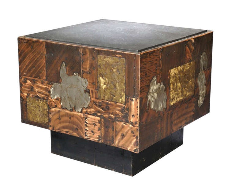 PE 31 Special: Table in copper, bronze, and pewter patchwork with plinth base and on casters.  The PE 31 was more commonly sold in 30