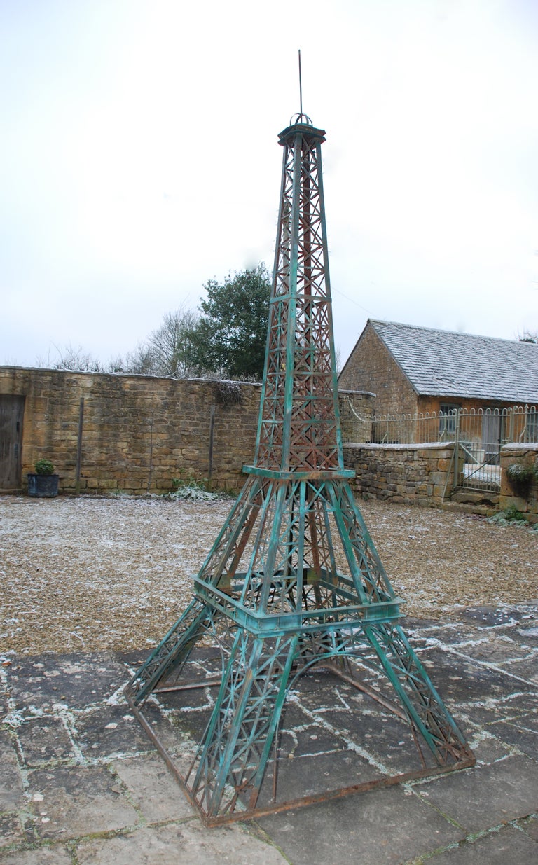 A 100th scale (height 3m/10 ft) folk art model of the Eiffel Tower, circa 1950.  The original, at a height of 320 metres, was designed by Gustave Eiffel and erected in 1889 for the World Fair of that year.  This quirky model is constructed from iron