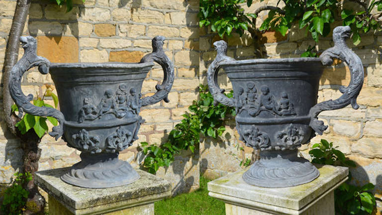 English A pair of large early 20th century lead urns