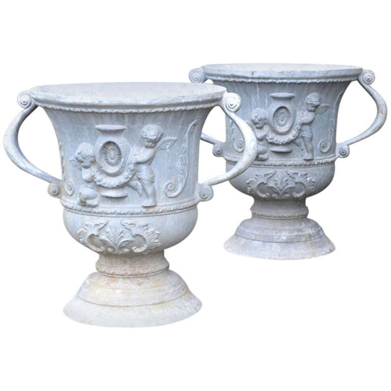A pair of early 20th century lead urns of campana form For Sale