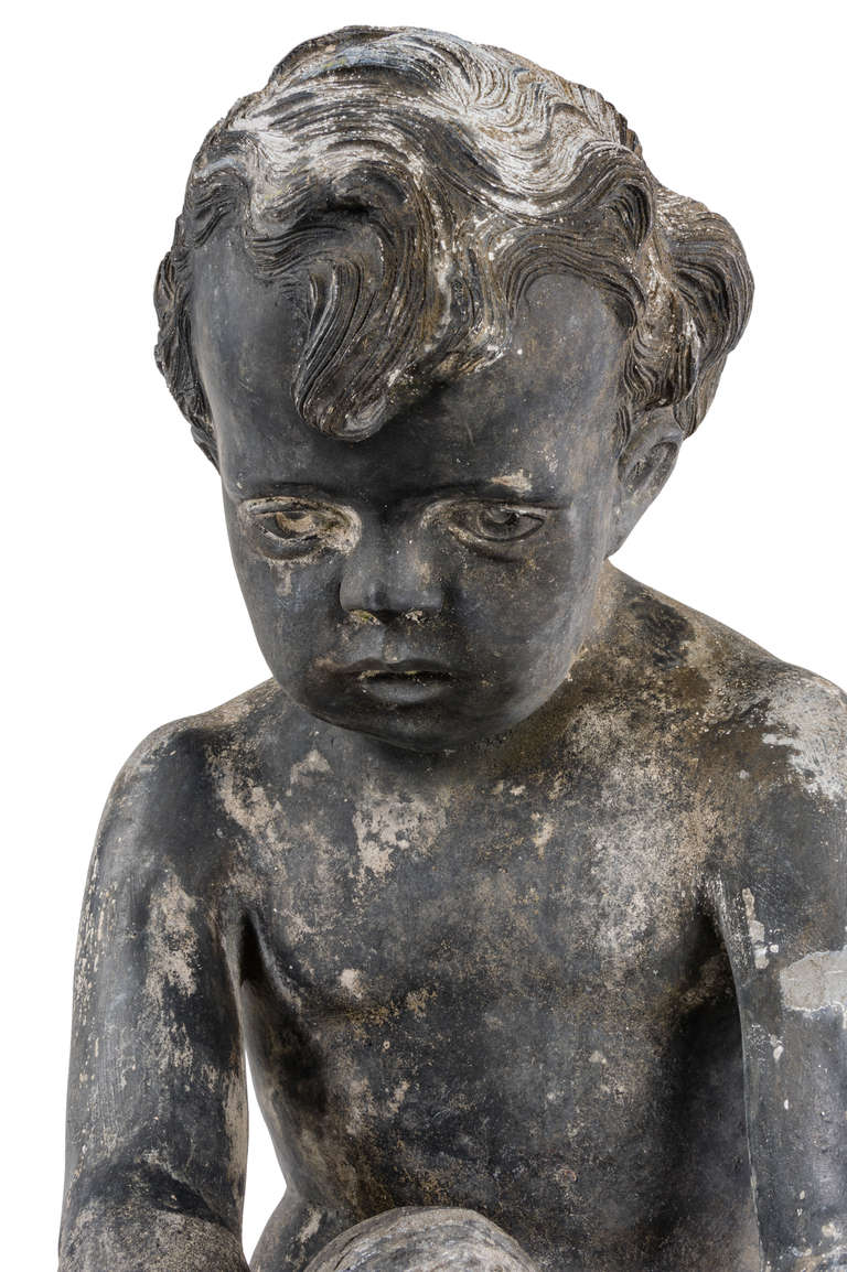 Lead An early 20th century lead fountain in the form of a boy holding a fish