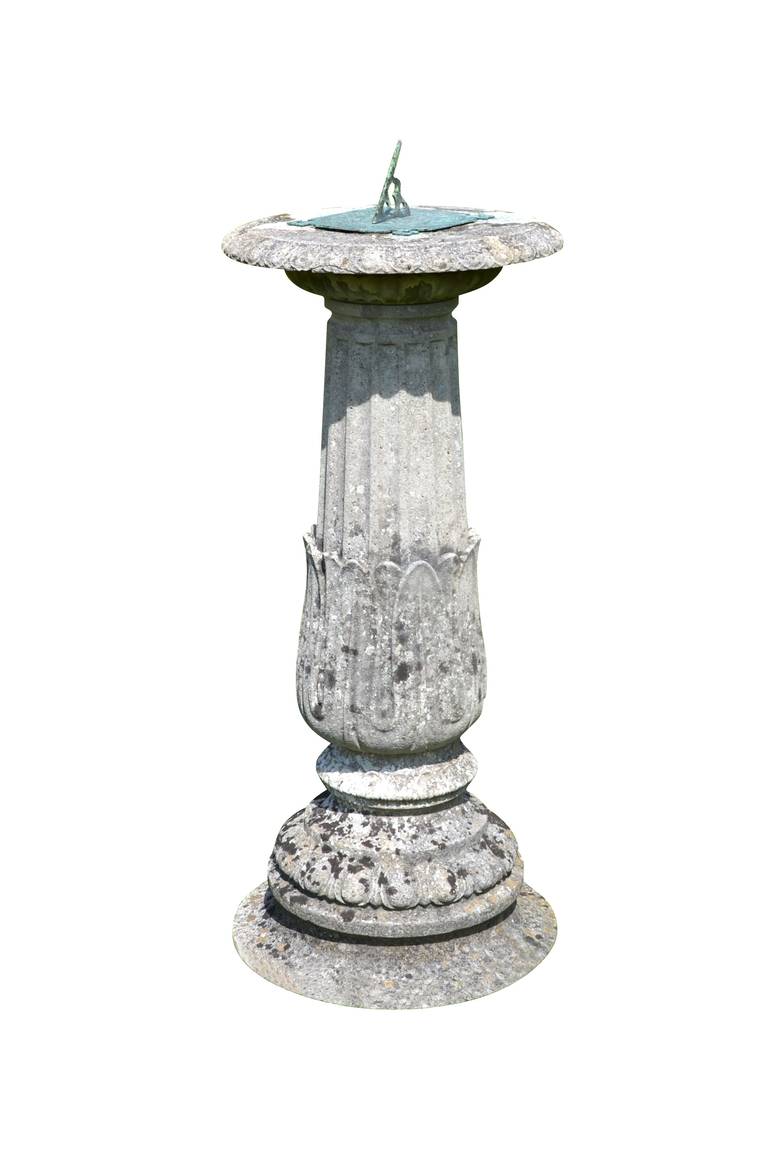 A late 19th century, circa 1880, composition sundial having circular top with egg and dart moulding, supporting a decorative dial plate. The main body is a fluted stem with lily leaf decoration, raised upon a circular socle.