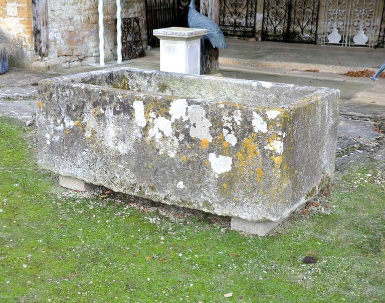 A large weathered antique limestone trough