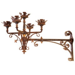 A neo-Gothic, French, wrought iron and parcel gilt wall light
