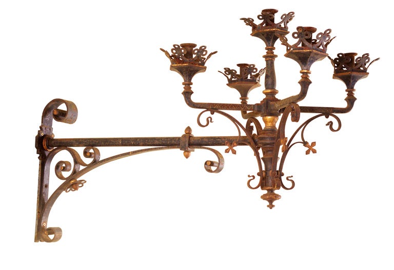 A neo-Gothic, French, wrought iron and parcel gilt wall light attributed to Frédérick Schertzer (1845 – 1929), with scrolling support and pierced trefoil motifs to the sockets, circa 1880. Five available.

Provenance: A chateau near Lorraine.