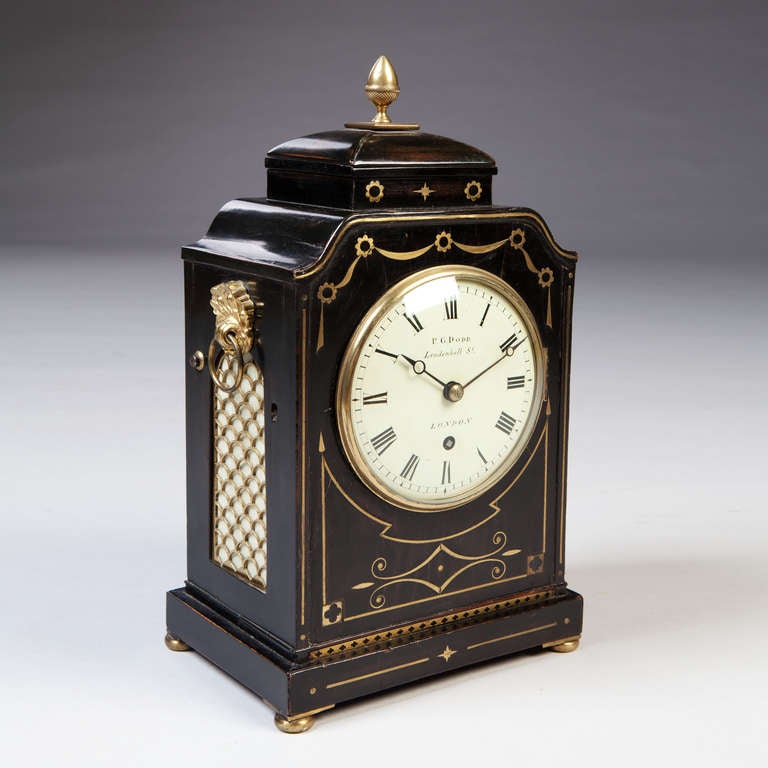 A fine early 19th century mantel clock by P G Dodd, the black ebonised case detailed with polished brass stringing. The case stamped with the retailers number *90*8834 and a further plaque on the interior reading 
