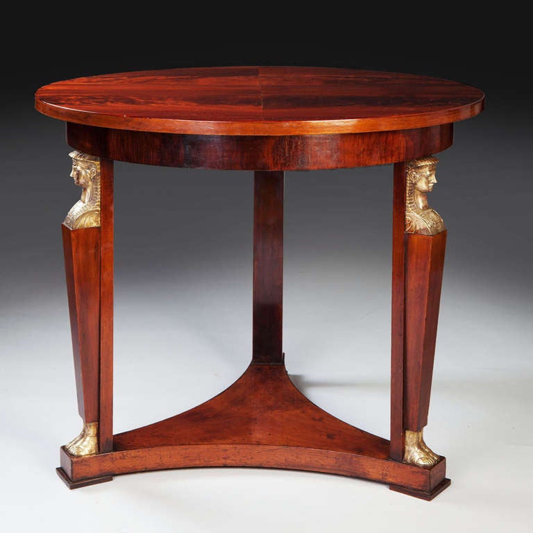 A fine mid 19th century mahogany gueridon mounted with fine Egyptian Sphinx head masks.