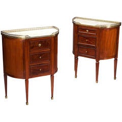 A pair of French mahogany and marble neo classical bedside cabinets