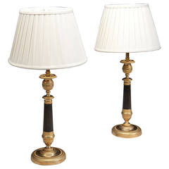 A pair of French Directoire Bronze and Gilt Bronze candle sticks as table lamps