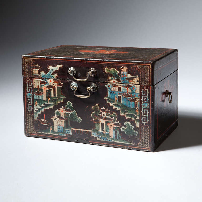 A very rare and unusual Chinese export lacquer painted box, the front finished in scenes painted in vibrant blue and white lacquer,  with swan neck handles on the front and drop handles on the sides. The top and side decorated with a large flower