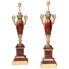 A Pair of Red Painted Tole Lamps