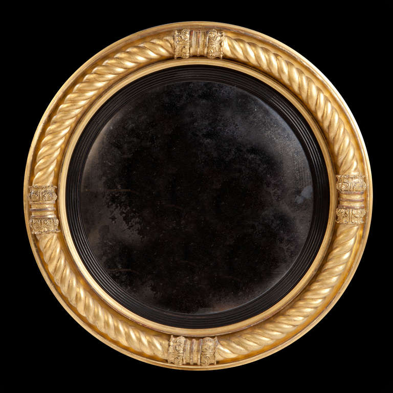 A large Early-19th Century gilt convex mirror, the border with stylized rope twist.