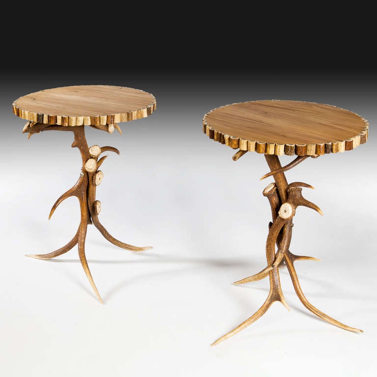 A pair of antler tables with polished walnut tops. Stamped on the underside R Coates