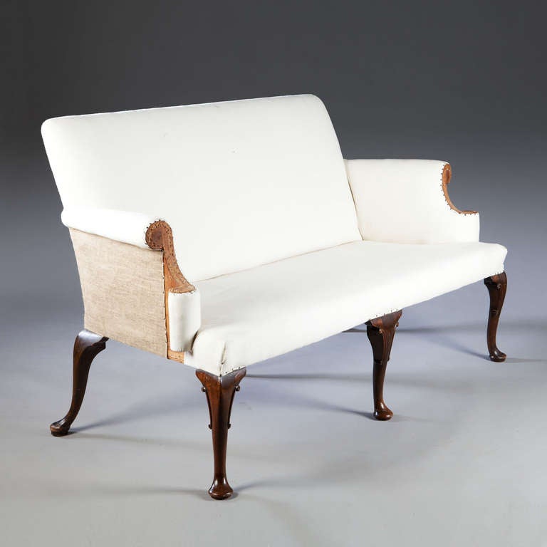 A fine 19th century Queen Anne settee of elegant proportions, the seat raised on mahogany cabriole pad feet.