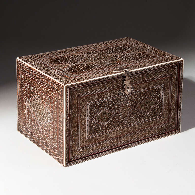 An exceptionally rare Anglo-Indian Sadeli casket, veneered throughout with fine micro mosaic. The fall front secured by a silver clasp, opening to a fitted interior of six different sized drawers, each with a silver ring handle. 

The sadeli