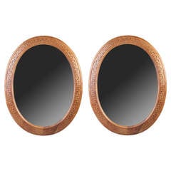A Pair of Large Scale Oval Mirrors