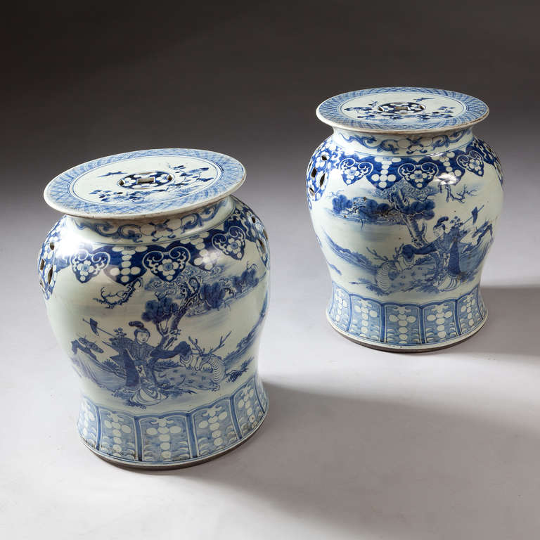 A fine pair of mid 19th century blue and white garden seats, decorated with courtesans and landscapes.