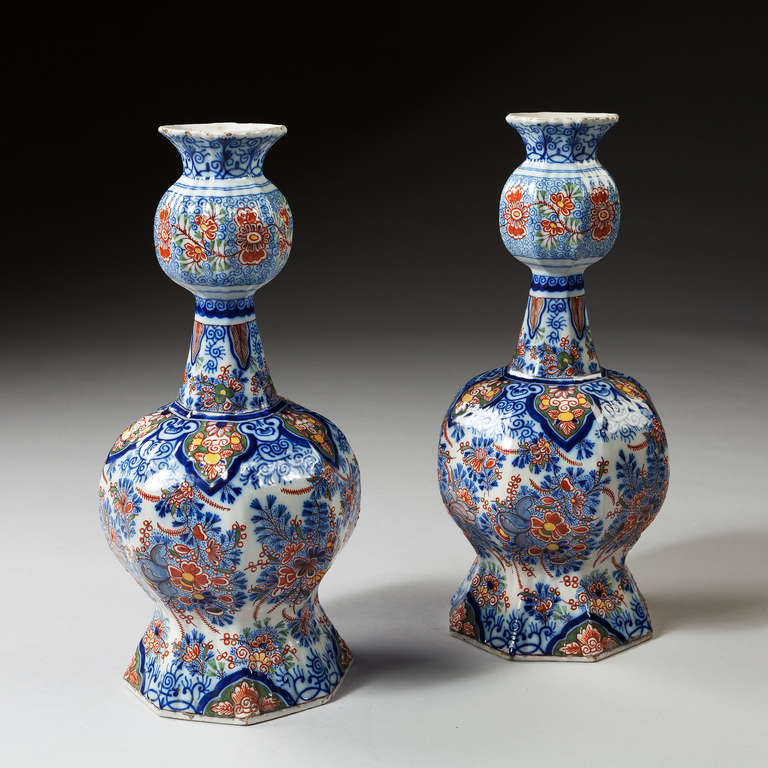 A very fine quality substantial pair of 19th century Dutch delft knobble vases, richly decorated in an unusual polychrome of iron red, yellow and green on a blue and white ground. Although not mounted yet, these vases would make fantastic table