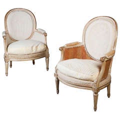 A Pair of Parcel Gilt Bergere Armchairs