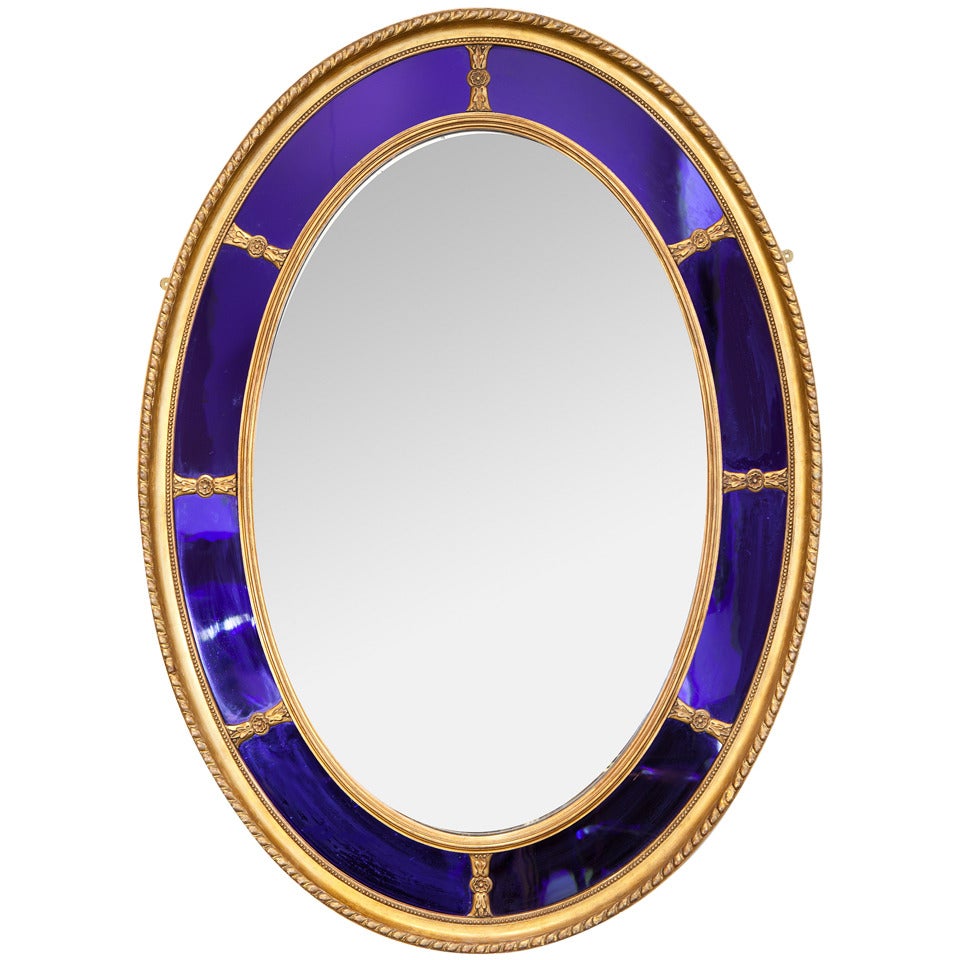 A Blue Glass Oval Mirror