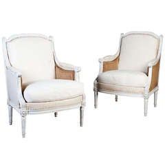 A Large Scale Pair of French Bergere Armchairs
