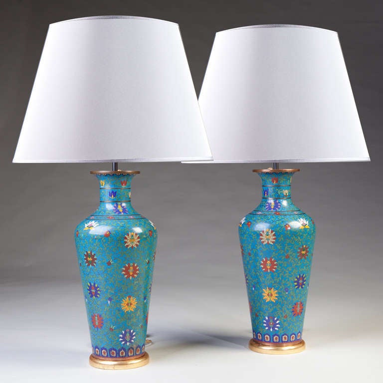 A large pair of 19th century cloisonne vases now mounted as lamps. 

Height of vases 51cm
Height to light fitting 78cm