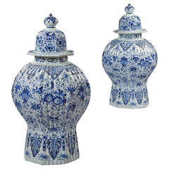 A fine pair of overscale Delft blue and white covered vases