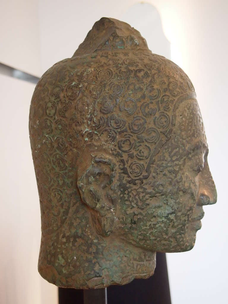 A Khmer Divinity stone head For Sale 1