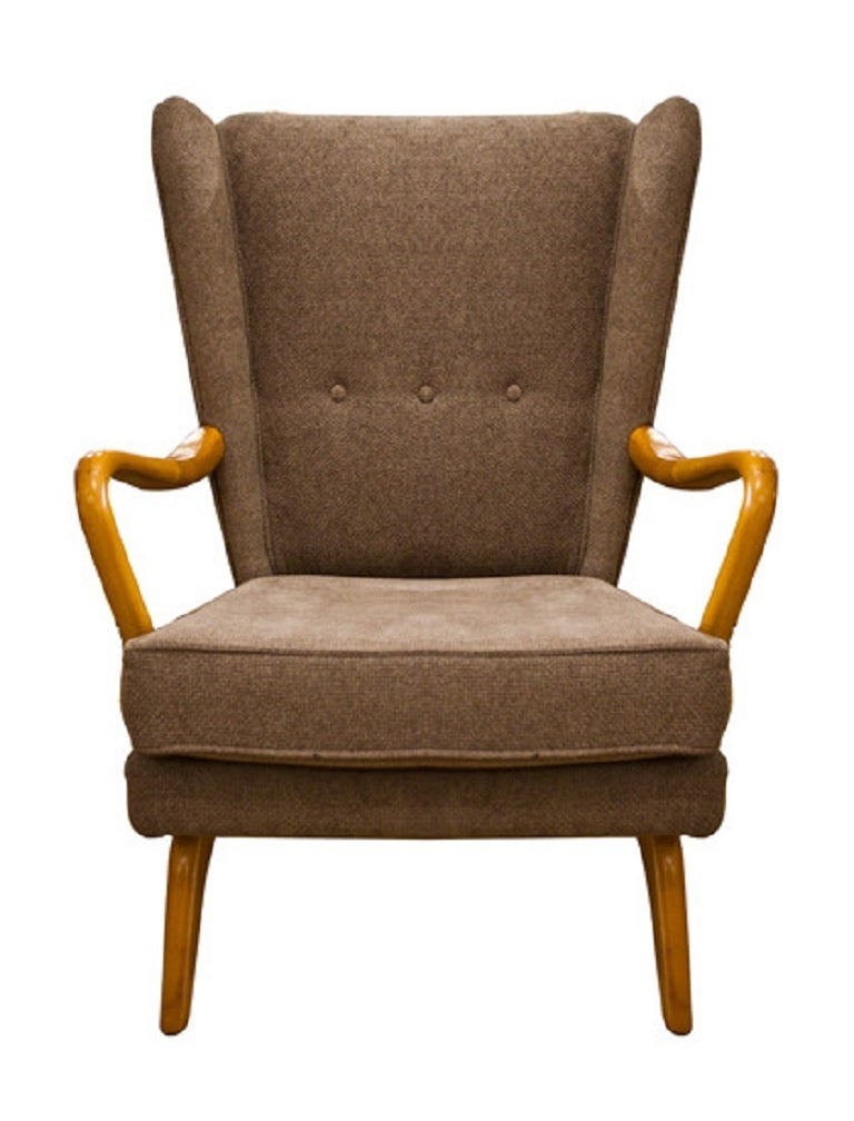 A Bambino Wingback Chair Designed by Howard Keith for HK Furniture London Ltd. 
This one has the wonderful curved arm.