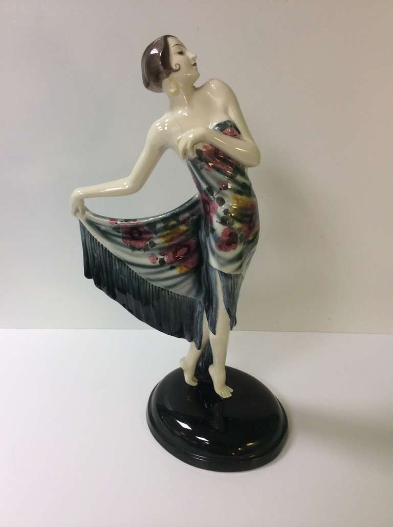 A Stunning Art Deco Figure of an Elegant Female wrapped in a Shawl.
A model designed by Lorenzl produce by Goldscheider Wien.
model number 5822 625 10