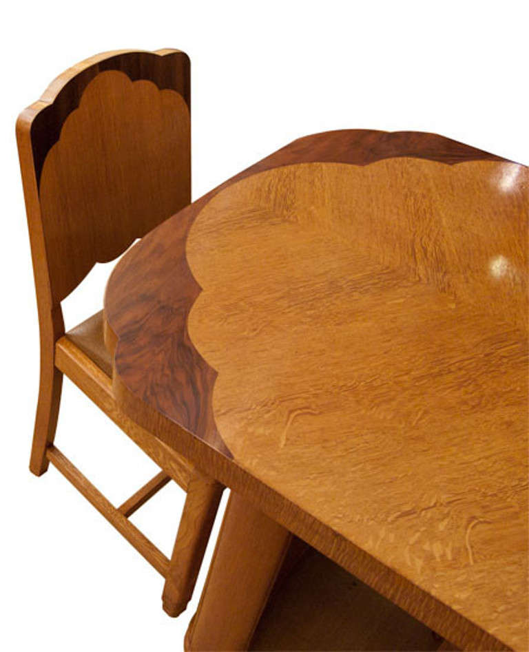 Art deco Golden Oak and Walnut Dining table and four chairs.
This has a really stylish look with the decorative walnut corners and to the tops of the chairs.
Table: H: 75 cm W: 152 cm D: 83 cm Chair: H: 88 cm W: 40 cm D: 50 cm