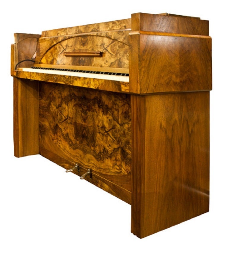 Art Deco Piano. 
A Fine Art Deco Burr Walnut Upright Mini Piano By Eavestaff. 
This Beautiful Piano has a lift back front with the handle doubling up as a music sheet stand, beautiful Burr walnut finish, good tone, but will need to be tuned once