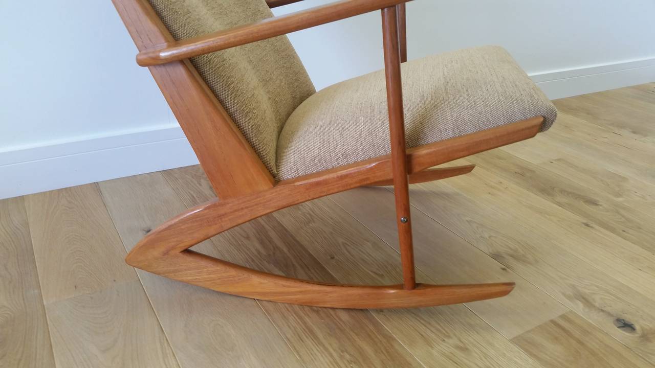 Exceptional Mid-20th Century Design from Holgar Georg Jensen. 
Beautifully crafted Teak Boomerang rocker. 
Re polished and re upholstered to an original finish. 
77 cm h 64 cm w 74 cm d seat depth is 47 cm