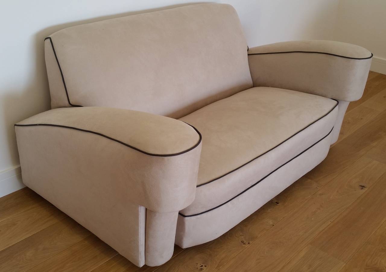A Rare Art Deco Bankers Suite, this Fabulous Art Deco Two Seater Sofa and Two Art Deco Armchairs comes in a soft cream Faux Suede with Black Pipping. 
This is A shape I have not had or seen before, comfort with amazing style. 
Sofa 75 cm h 162 cm