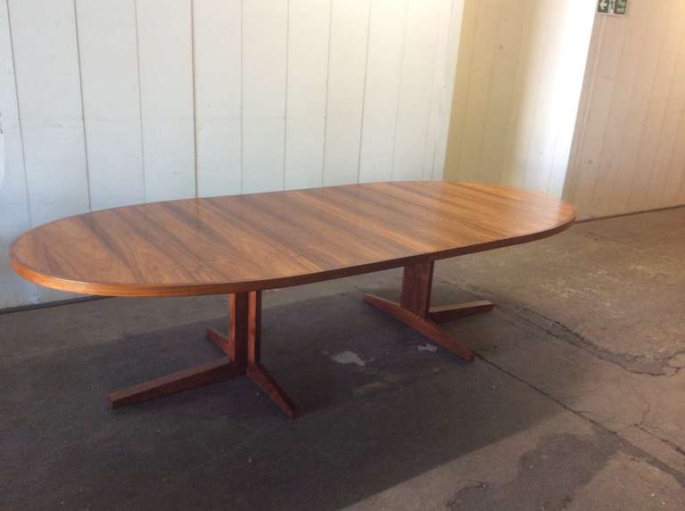 John Mortensen, architect designer<br />
<br />
Mid-20th century design, a fine extendable rosewood dining table. Designed by John Mortensen for Heltborg Mobelfabrik.<br />
<br />
The table is 190 cm w and 123 cm d when closed. It has two leaves