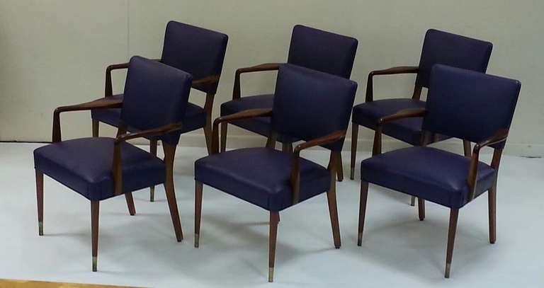 A stunning set of six rosewood conference chairs, beautifully re-upholstered in a Mauve Leather, fine quality solid rosewood, the turned legs having brass caps which are height adjustable for uneven flooring,
British, circa 1960.
Possibly by