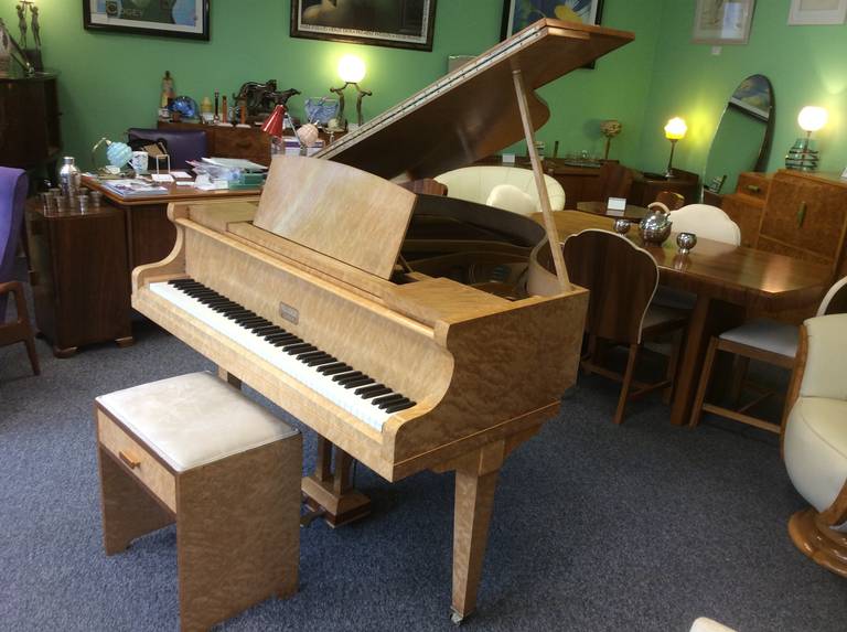 A Splendid Art Deco Mini Baby Grand Piano in a Burr Elm case with Walnut trims. 
Made By Allison of London with a Miraflex soundboard. 
Plays beautifully with a very good tone. 
98 cm h 140 cm w 128 d 
Stool is 55 cm h 52 cm w 36 cm d