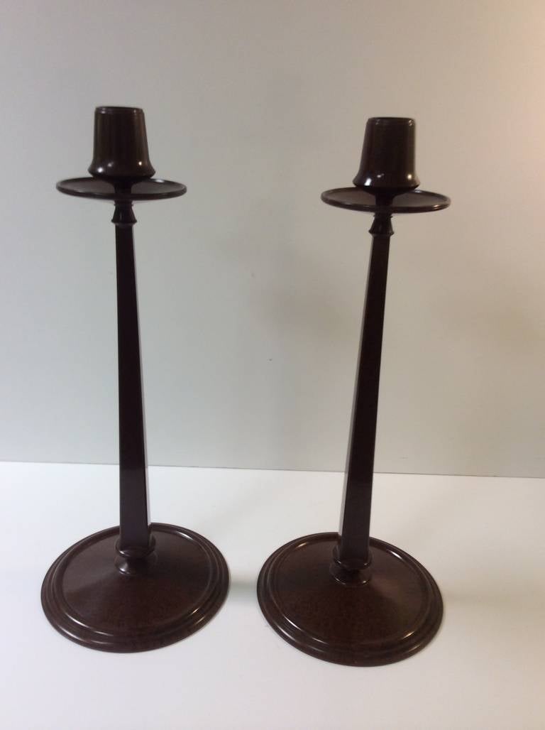A Fine Pair of Tall Tapered Bakelite Candlesticks. 
By Linsden Ware. excellent quality each section with screw fitting, the brown bakelite with a nice marbling throughout. 
36.5 cm high 15 cm dia at the base