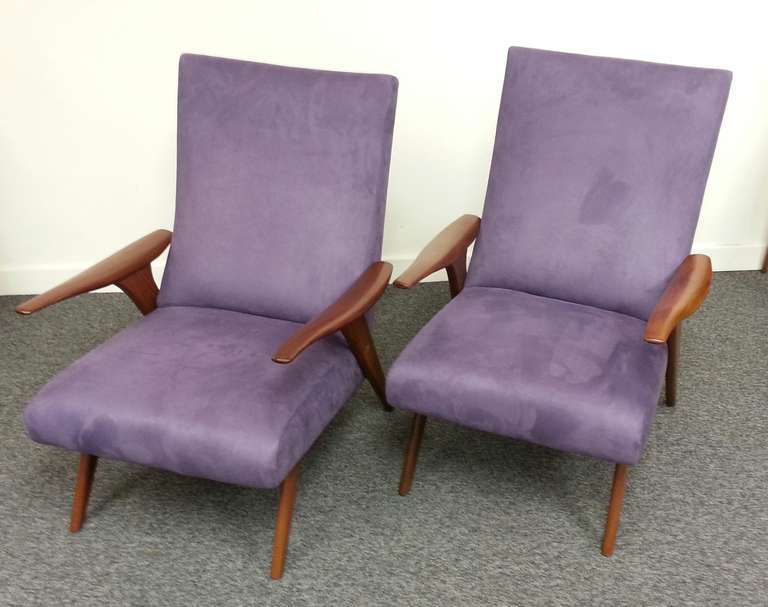 A truly fabulous pair of mid-20th century design armchairs By Greaves and Thomas of Mayfair London. 
Beautiful African sapele, re-upholstered in a mauve soft faux suede,
British, circa 1960.
Measures: 88 cm H, 67 cm W, 80 cm D.