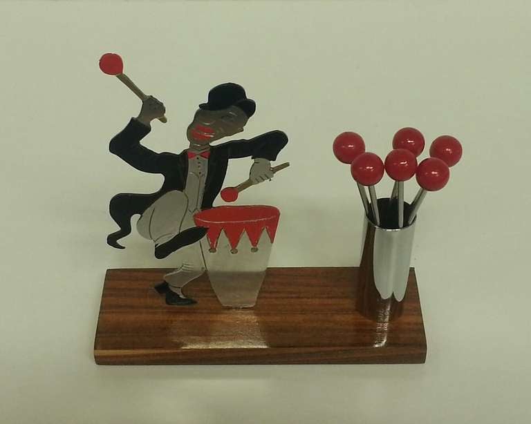 Superb Art Deco Cocktail Sticks with a dancing Drummer Man on a Rosewood Base.