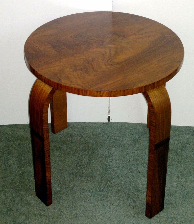 A very striking Art Deco Table designed by Alvar Aalto. superb Figured walnut veneer with a band of Macassar on each leg. 