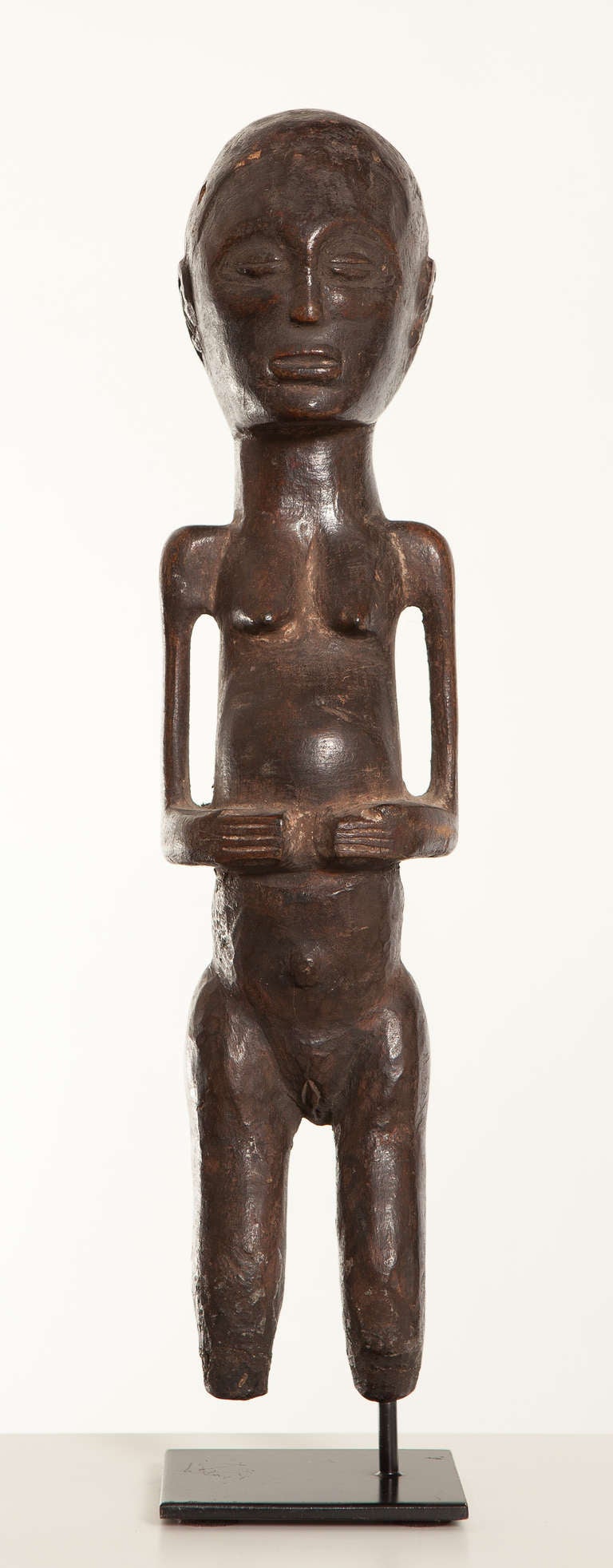 Female  Mwanga figure with realistic appearance. Feet are missing.