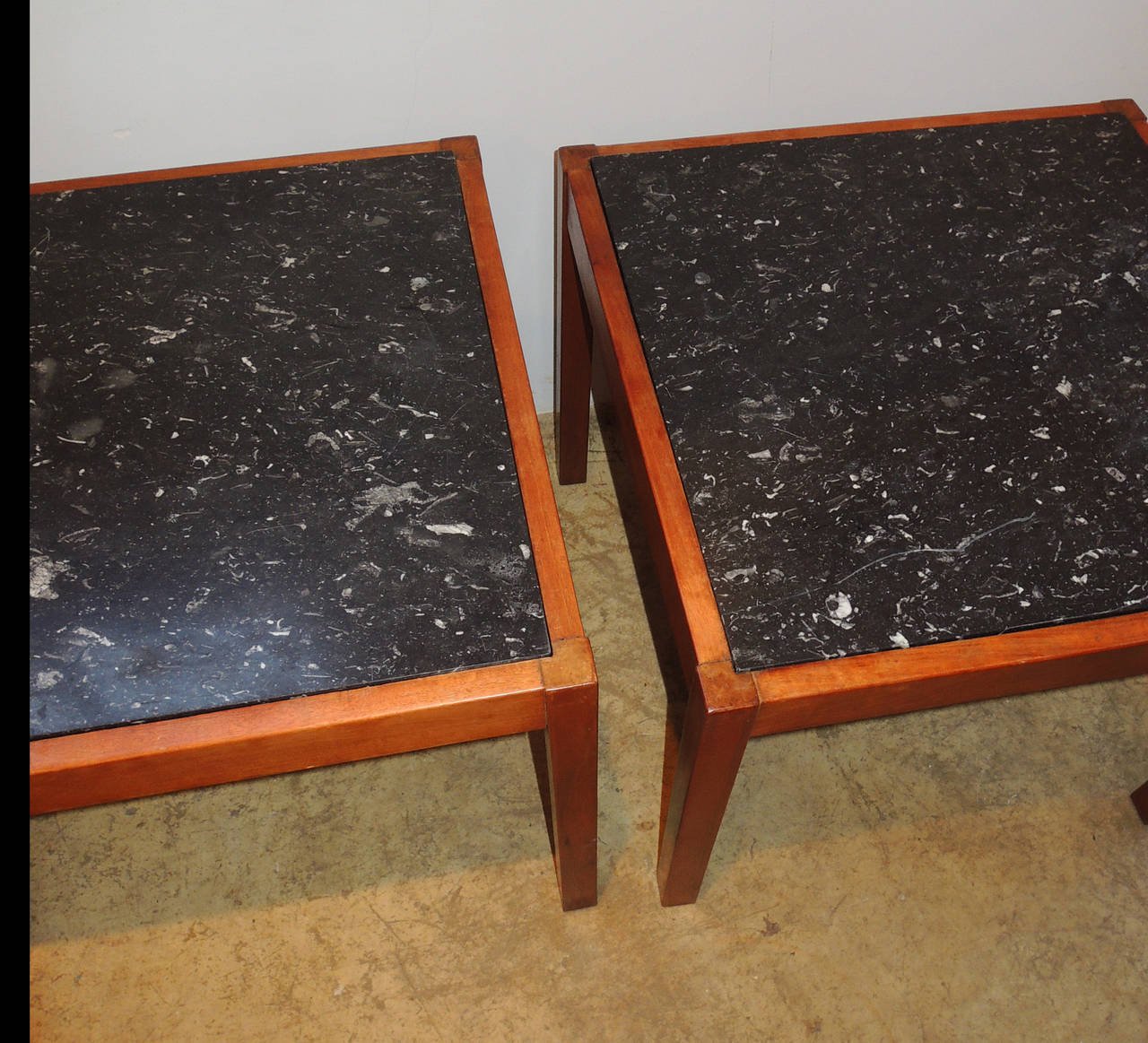 Pair of side or end tables with Belgian black limestone in teak.