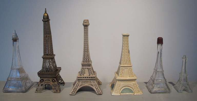 A collection of six Eiffel Tower cognac bottles, c. 1950.
Collection of six bottles. Tallest is 17