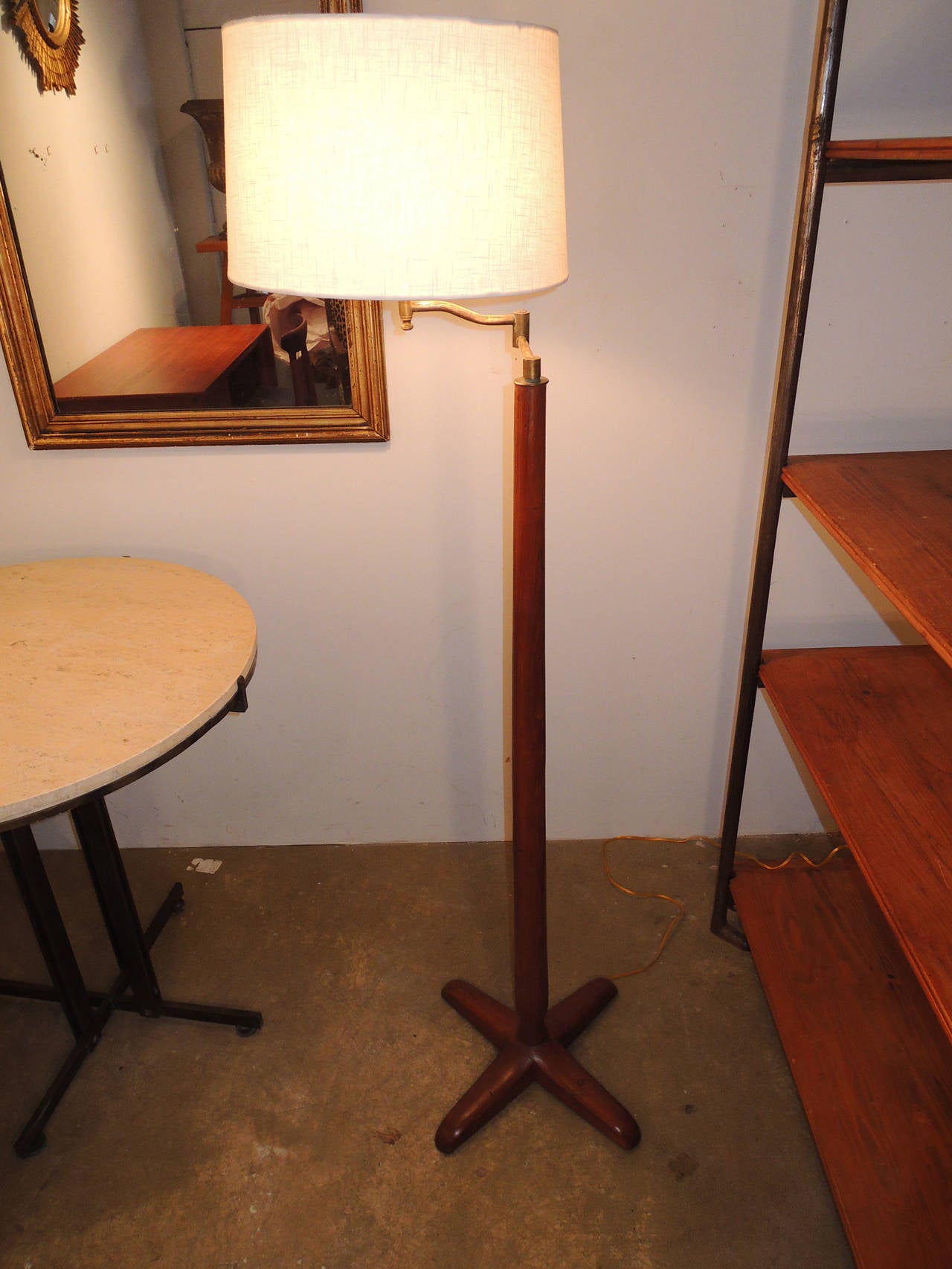 Solid mahogany standing lamp. The green metal tag on base reads: 