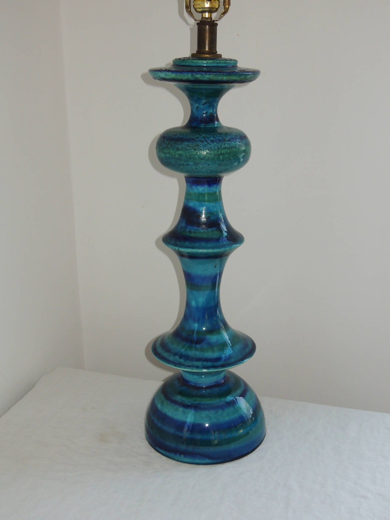 Classic turquoise blue ceramic of Bitossi. Tall, elegant form.
Rewired. 23.5 high to socket.
