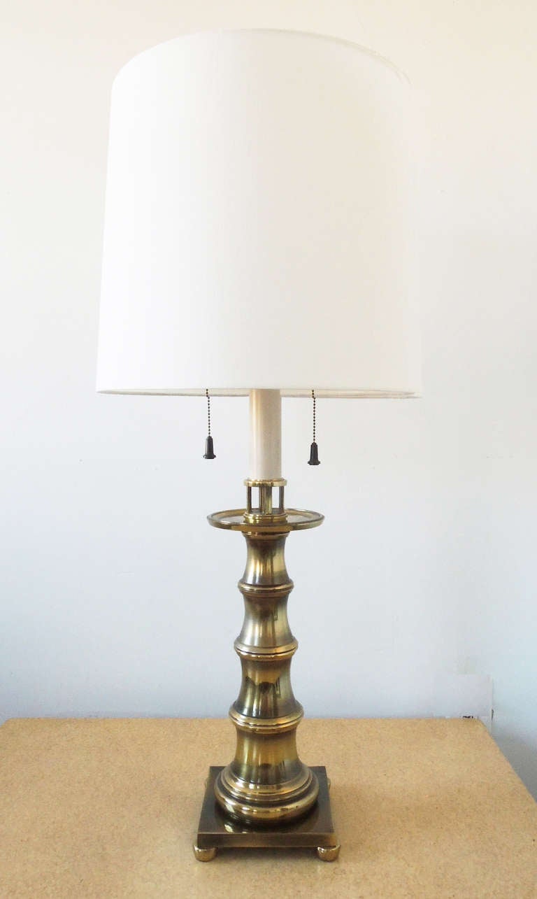 Beautiful faux bamboo table lamp by Stiffel. Label on both sockets. Note important details: clear, bright brass; pedestal base with bun feet,  long tassel pulls.