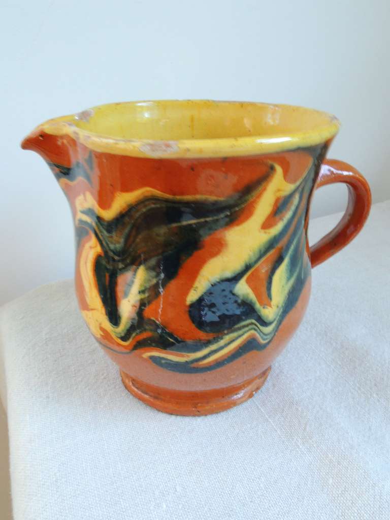 Jaspé pitcher from Savoie, France. For a utilitarian, quotidian object, Jaspé pitchers and bowls, with their swirled glazes or abstract polka dots, are amazing examples of folk art that look very modern!
Can still be used as originally purposed,